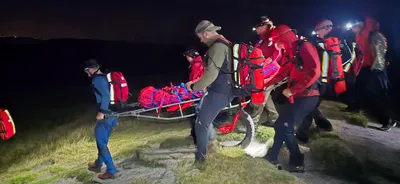 #39-2026 Walker with Injured Wrist At The Top Of Sandy Heyes